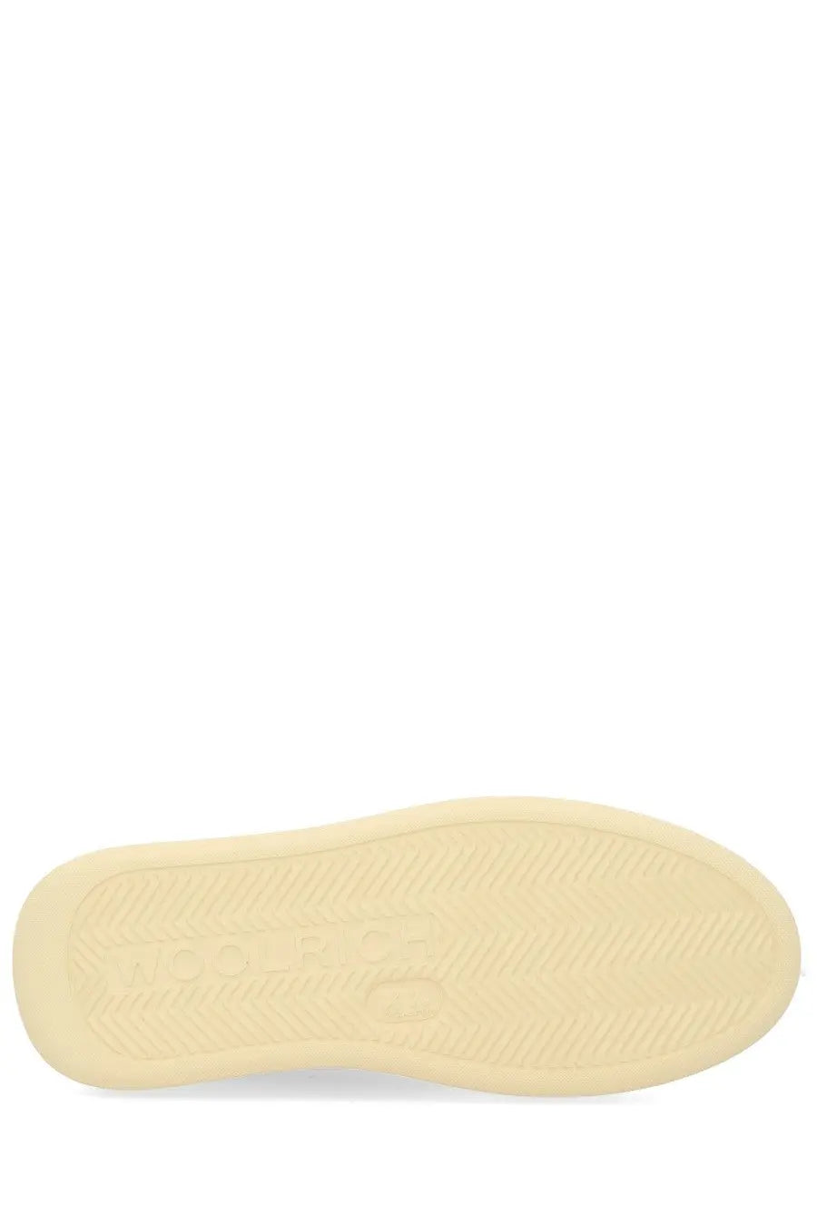 Cream-colored rubber sole with subtle texture and embossed branding on woolrich womens pelle pink sneaker