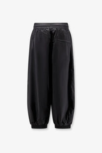 Y3 men’s baggy nylon trousers black with sleek minimalist design and smooth lightweight fabric