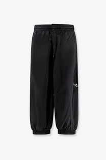 Y-3 men’s baggy black nylon track pants with drawstring waist and elastic cuffs for comfortable wear