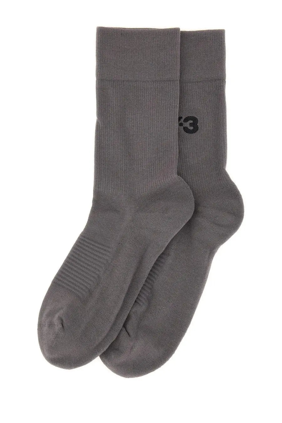 A pair of y-3 men’s classic crew socks in dark gray with subtle ribbed texture and small black side logo