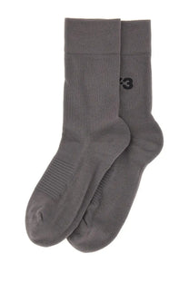 A pair of y-3 men’s classic crew socks in dark gray with subtle ribbed texture and small black side logo