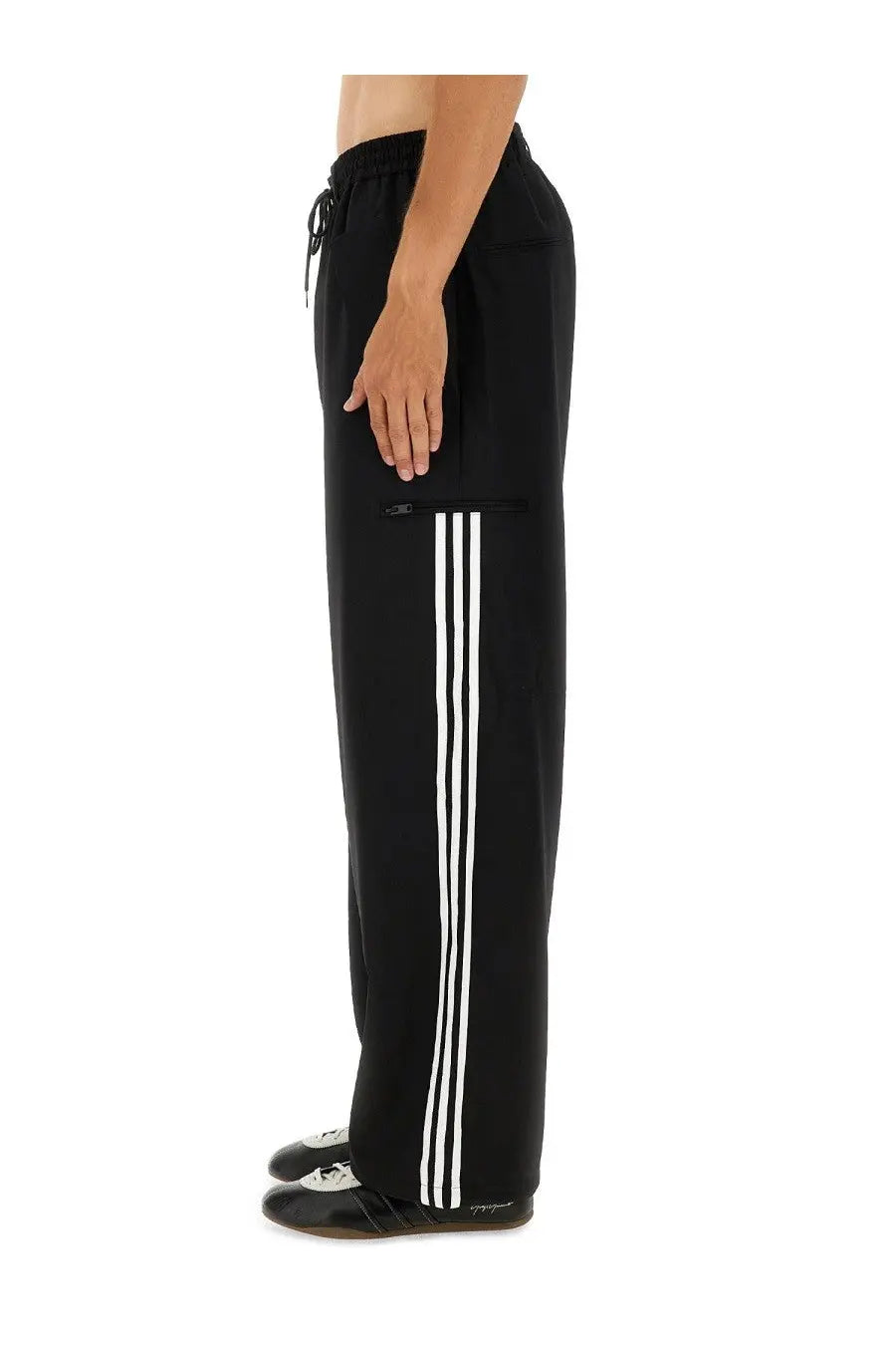 Y-3 men’s jogger pants black featuring three bold white side stripes drawstring waistband and front pockets