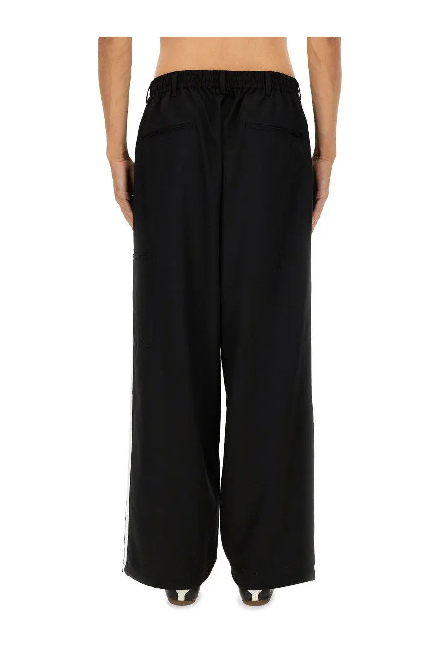 Y-3 men’s black jogger pants with wide-leg cut drawstring waistband and subtle white side stripes