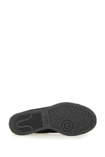 Black rubber sole with textured circular tread design on y-3 men’s nizzastar hi sneaker black