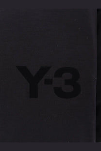 Black y-3 logo printed on textured dark gray surface of y-3 men’s padded jersey sweatshirt black