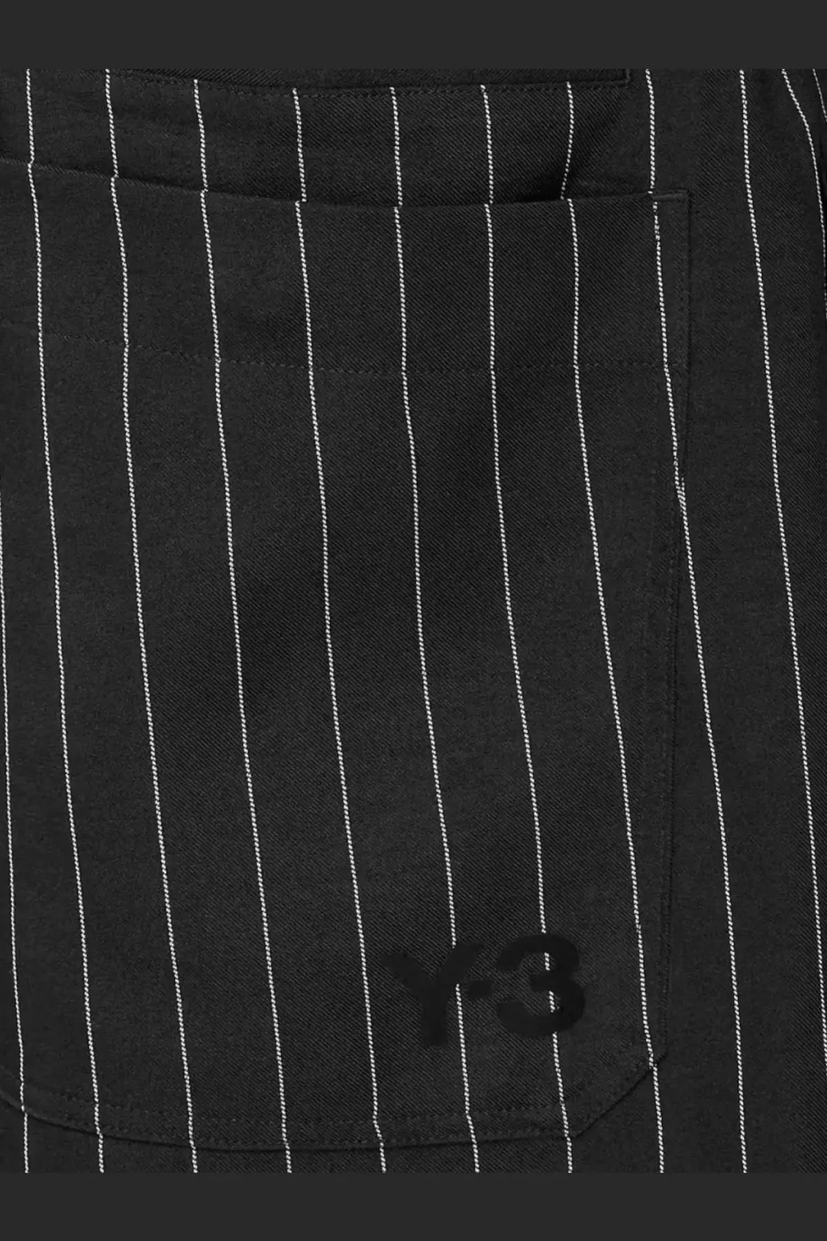 Black y-3 men’s pinstriped fabric bermuda shorts featuring subtle logo embroidery on the front pocket