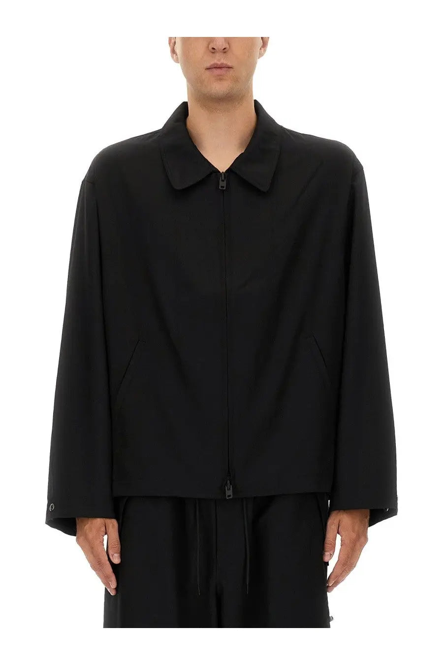 Black minimalist y-3 men’s refined wool jacket with collar and front zipper for stylish outerwear