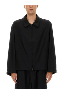 Black minimalist y-3 men’s refined wool jacket with collar and front zipper for stylish outerwear