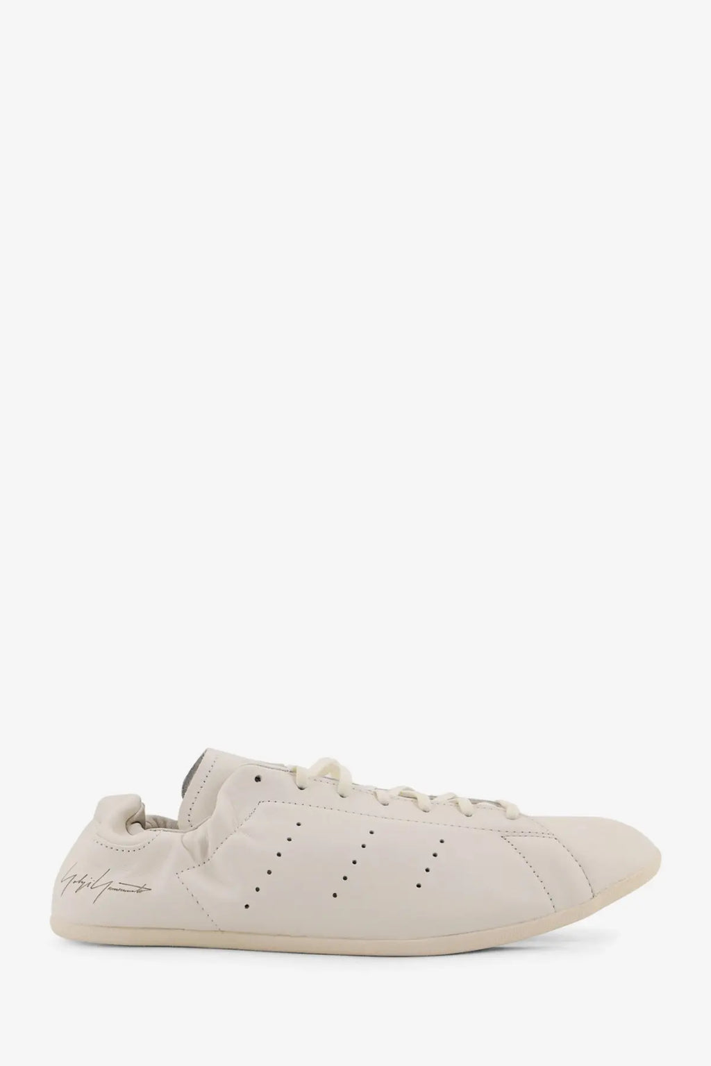 Cream-colored leather y-3 men’s stan smith lo pro sneaker with adidas three stripes and embroidered logo on the side