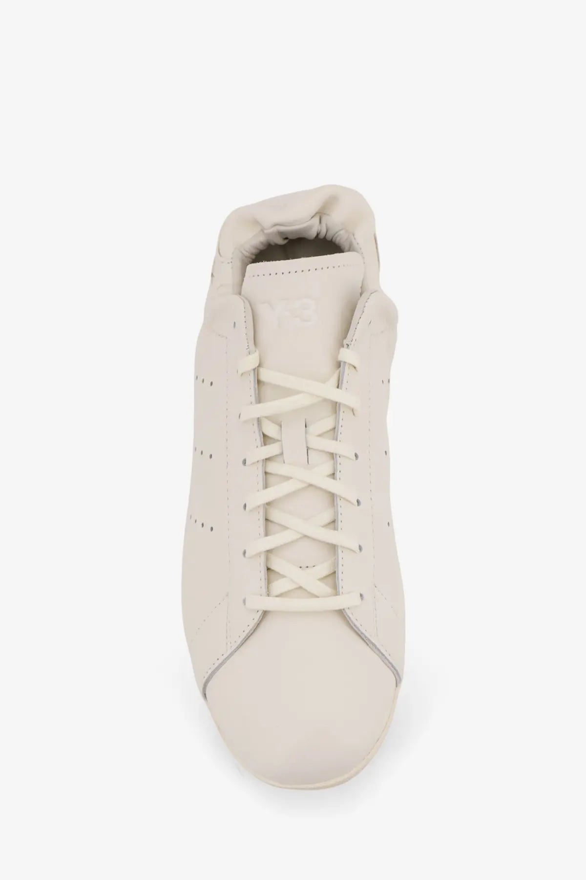 Cream-colored leather adidas y-3 men’s stan smith lo pro sneaker with matching laces and subtle side perforations