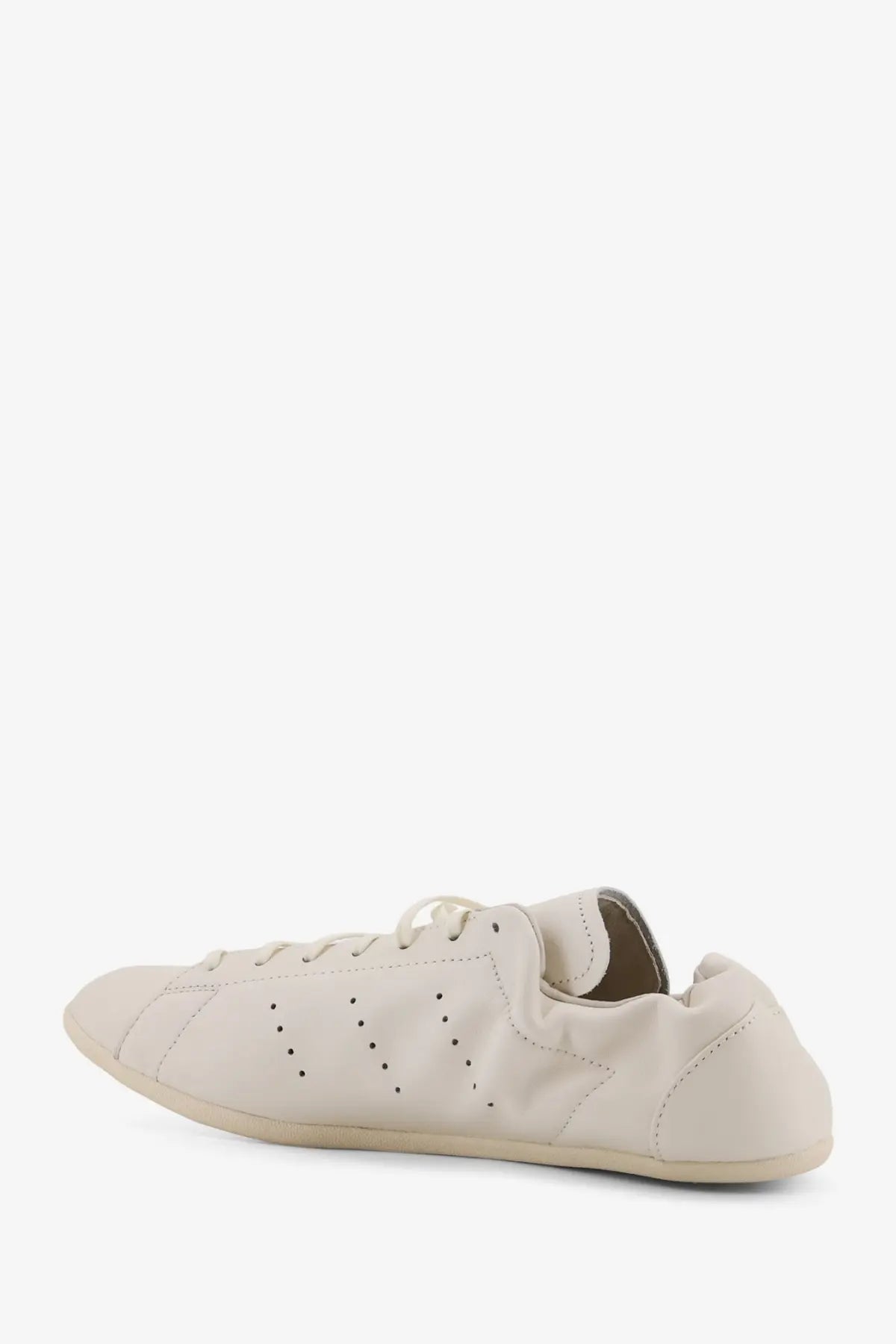 Y-3 men’s stan smith lo pro white leather sneaker with cream color perforated minimalist design