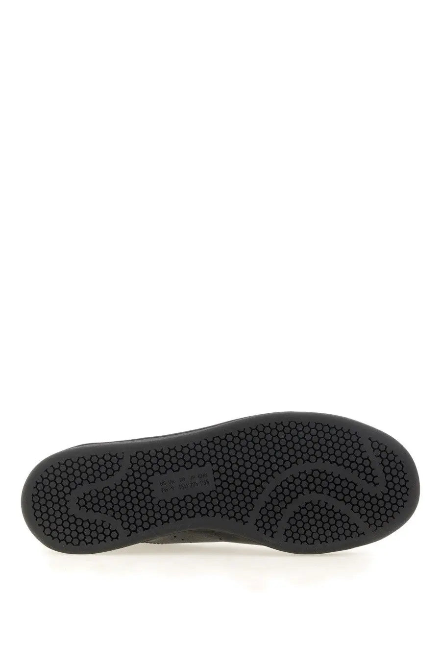 Black rubber sole with hexagonal tread pattern and small label near the heel of y-3 men’s stan smith sneaker black