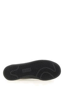 Black rubber sole with hexagonal tread pattern and small label near the heel of y-3 men’s stan smith sneaker black