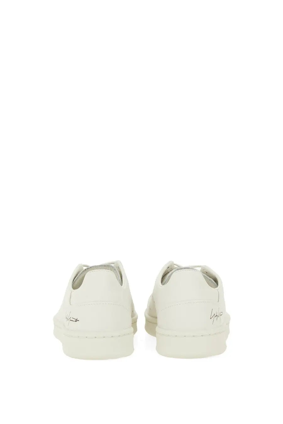 White leather y-3 men’s stan smith sneaker in grey showing minimalist design and subtle branding on the heel back side