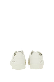 White leather y-3 men’s stan smith sneaker in grey showing minimalist design and subtle branding on the heel back side