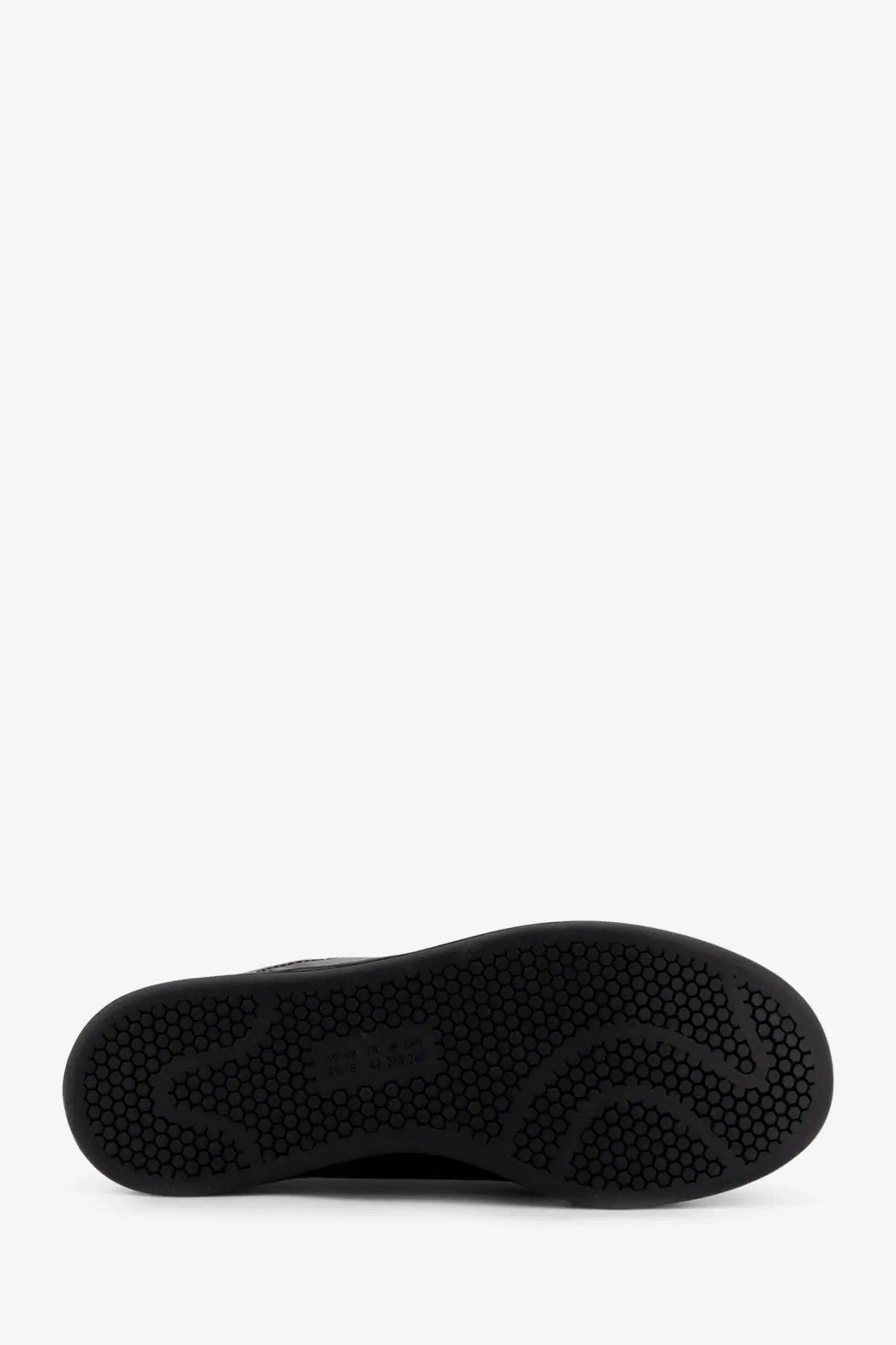 Black rubber sole with hexagonal tread pattern on y-3 men’s stan smith velcro grey leather sneakers