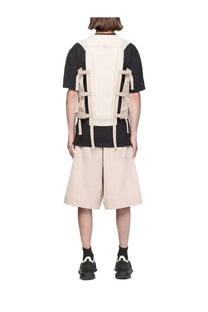Y-3 men’s beige and black utility vest with adjustable straps designed for functional streetwear use