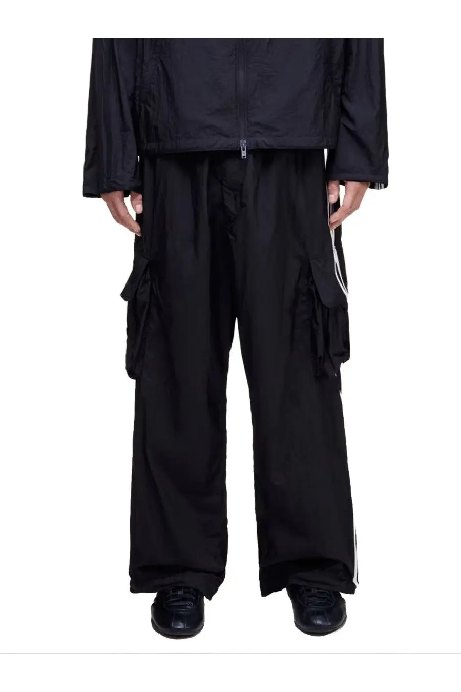 Y-3 unisex black cargo pants with wide legs and white side stripes in a comfortable polyester fabric