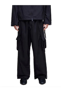 Y-3 unisex black cargo pants with wide legs and white side stripes in a comfortable polyester fabric