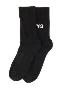 Black y-3 unisex classic crew socks featuring white embroidered logo on black cotton blend fabric for everyday wear