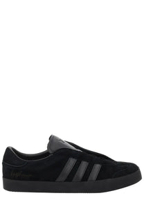 Black suede adidas y-3 unisex gazelle sneaker with three dark gray stripes and signature logo on the side