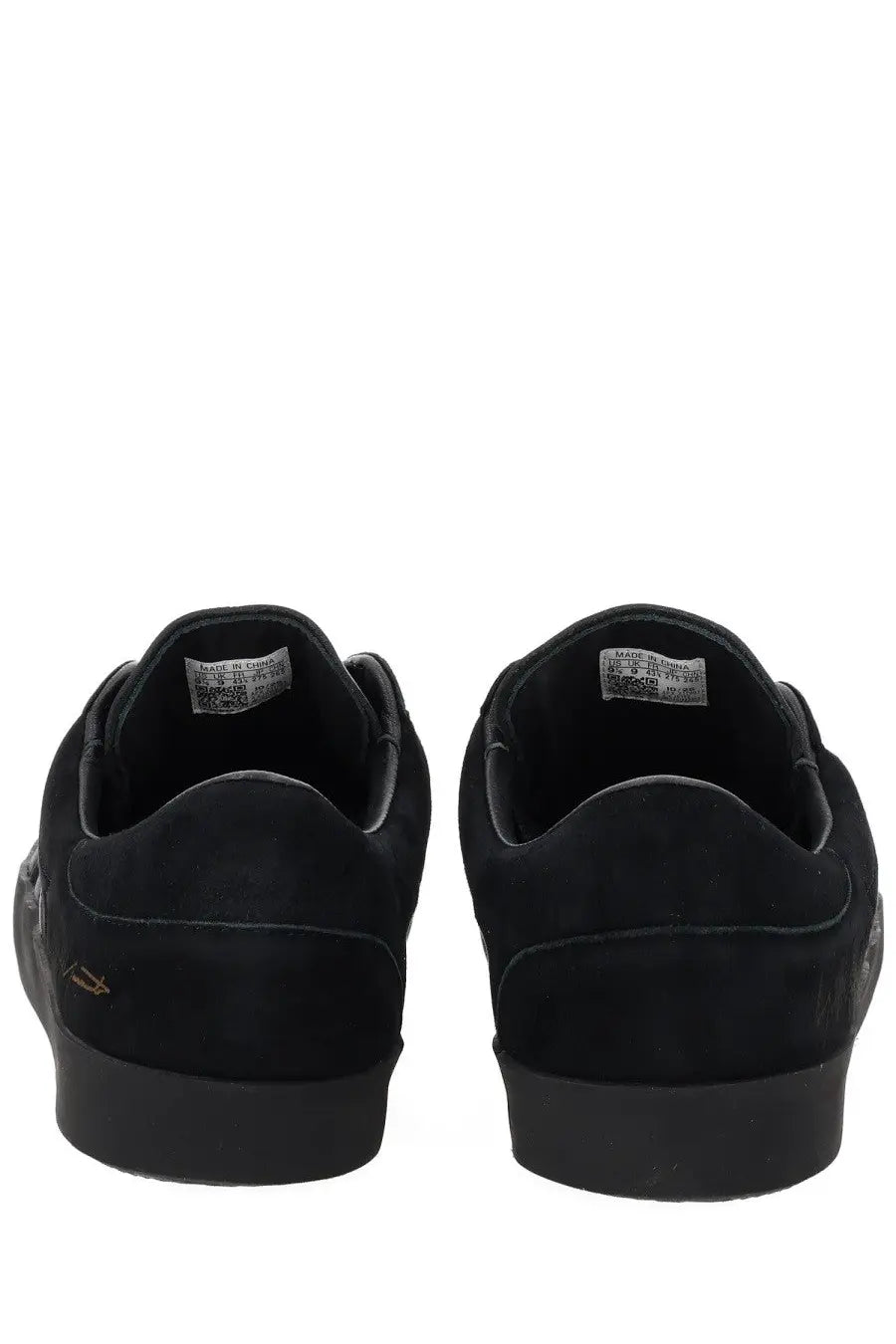 Black suede y-3 unisex gazelle low-top sneakers with matte finish and subtle gold logo on the heel back side