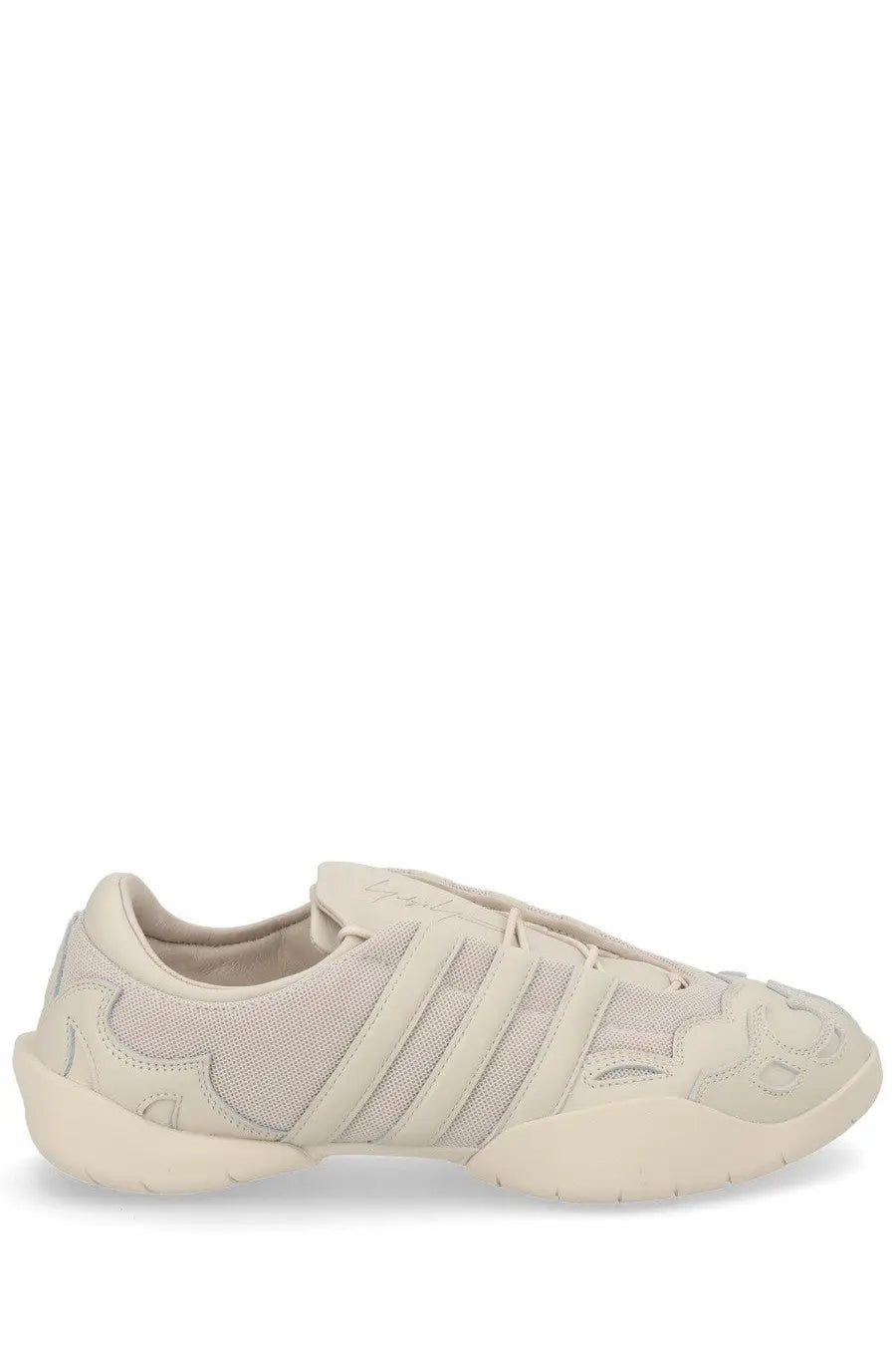 Cream-colored adidas x y-3 unisex sneaker with mesh and suede upper featuring three stripes and sculpted toe box