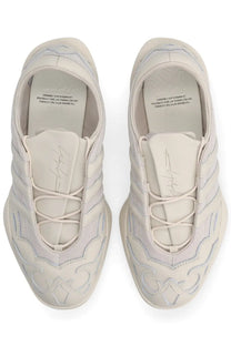Cream-colored y-3 unisex regu sneaker with intricate embroidered patterns and sleek modern design in grey tones