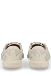 Cream-colored Y-3 unisex regu sneaker with sleek mesh and leather panels in a minimalist design