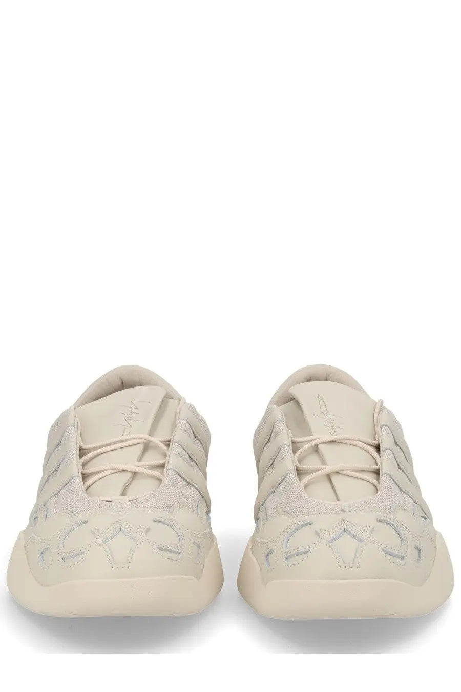 Cream-colored Y-3 unisex regu sneaker with textured perforated upper and chunky rubber sole in grey tones
