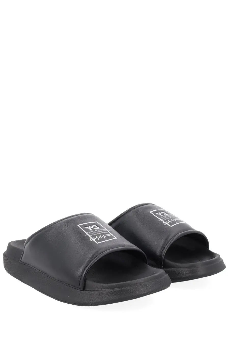 Black y-3 unisex slide sandals with sleek minimalist design and white logo detailing on the strap