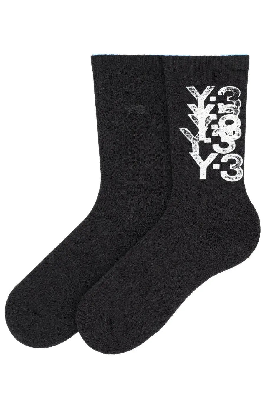 Black y-3 unisex crew socks with bold distressed white y-3 logo stacked vertically on the side for casual wear