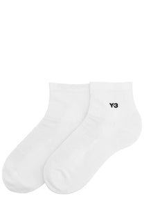 White y-3 unisex ankle socks with minimalist design and subtle black logo on cuff made from soft cotton blend
