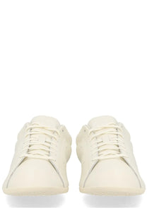 Cream-colored leather Y-3 Unisex Stan Smith LO Pro sneaker with minimalist design and matching laces in white