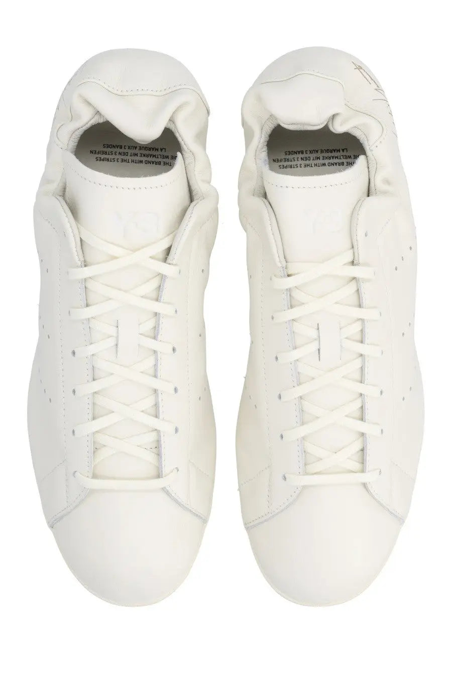 White leather y-3 unisex stan smith lo pro sneaker with classic lace-up design and subtle perforations