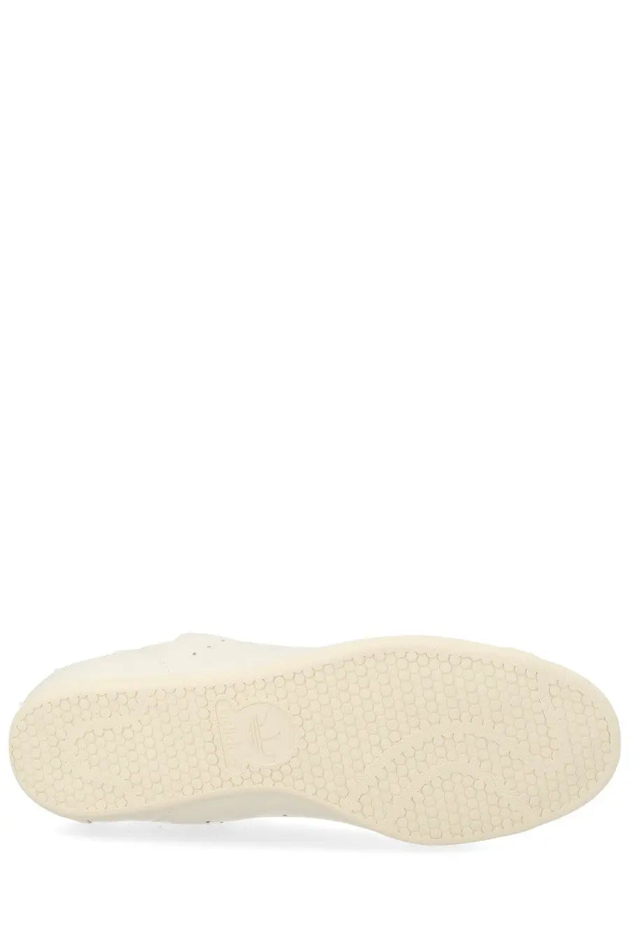 White rubber sole with textured hexagonal pattern on y-3 unisex stan smith lo pro sneaker white