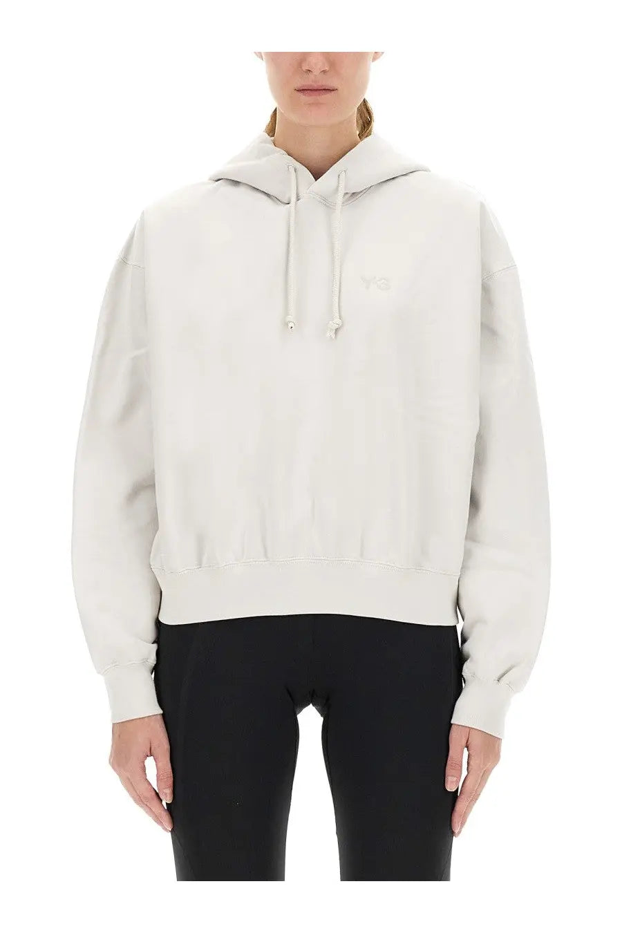 Cream-colored y-3 women’s hooded sweatshirt with subtle embroidered logo and matching drawstrings in soft fabric