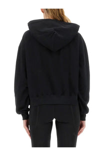 Y-3 women’s black cropped hoodie with relaxed fit and ribbed cuffs made from soft material for casual wear