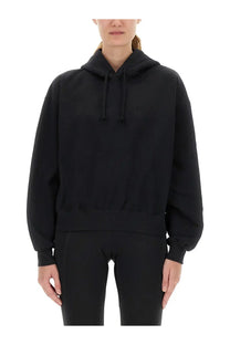 Y-3 women’s black oversized hoodie with relaxed fit and ribbed cuffs made from soft fabric
