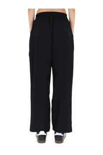 Black y-3 women’s jogging pants with elastic waistband side pockets and wide-leg design for comfortable wear