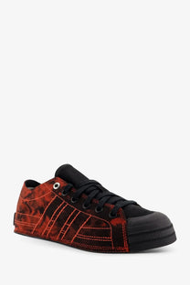 Y-3 women’s nizza lo canvas sneakers black featuring red and black camouflage pattern with bold red stitching on stripes