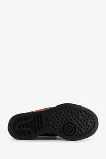Black rubber sole with textured tread and circular logo on y-3 women’s nizza lo canvas sneakers black