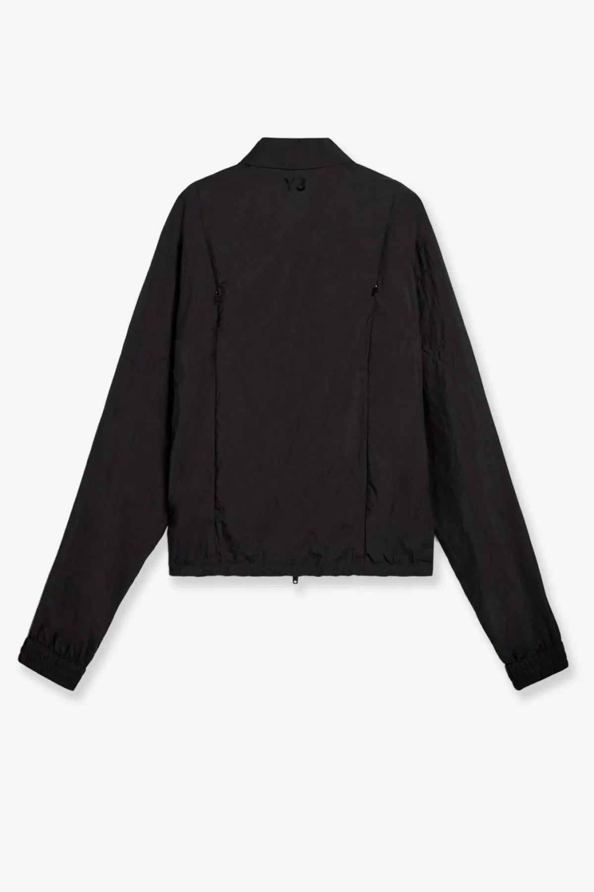 Black y-3 women’s nylon bomber jacket with subtle stitching and minimalist design shown from the back side
