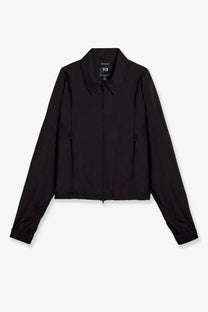 Black y-3 women’s nylon zip-up jacket with sleek minimalist design and subtle branding at the collar