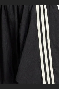 Y-3 women’s black nylon skirt with three bold white stripes on the side made from lightweight textured fabric