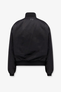Y-3 women’s recycled nylon bomber jacket in black with sleek matte finish and subtle logo at the collar