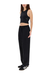 Y-3 women’s black crop top with subtle chest logo and matching black sweatpants with elastic waistband and drawstring