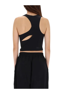 Back view of a black Y-3 women’s cropped sports bra with cut-out design for running and athletic use
