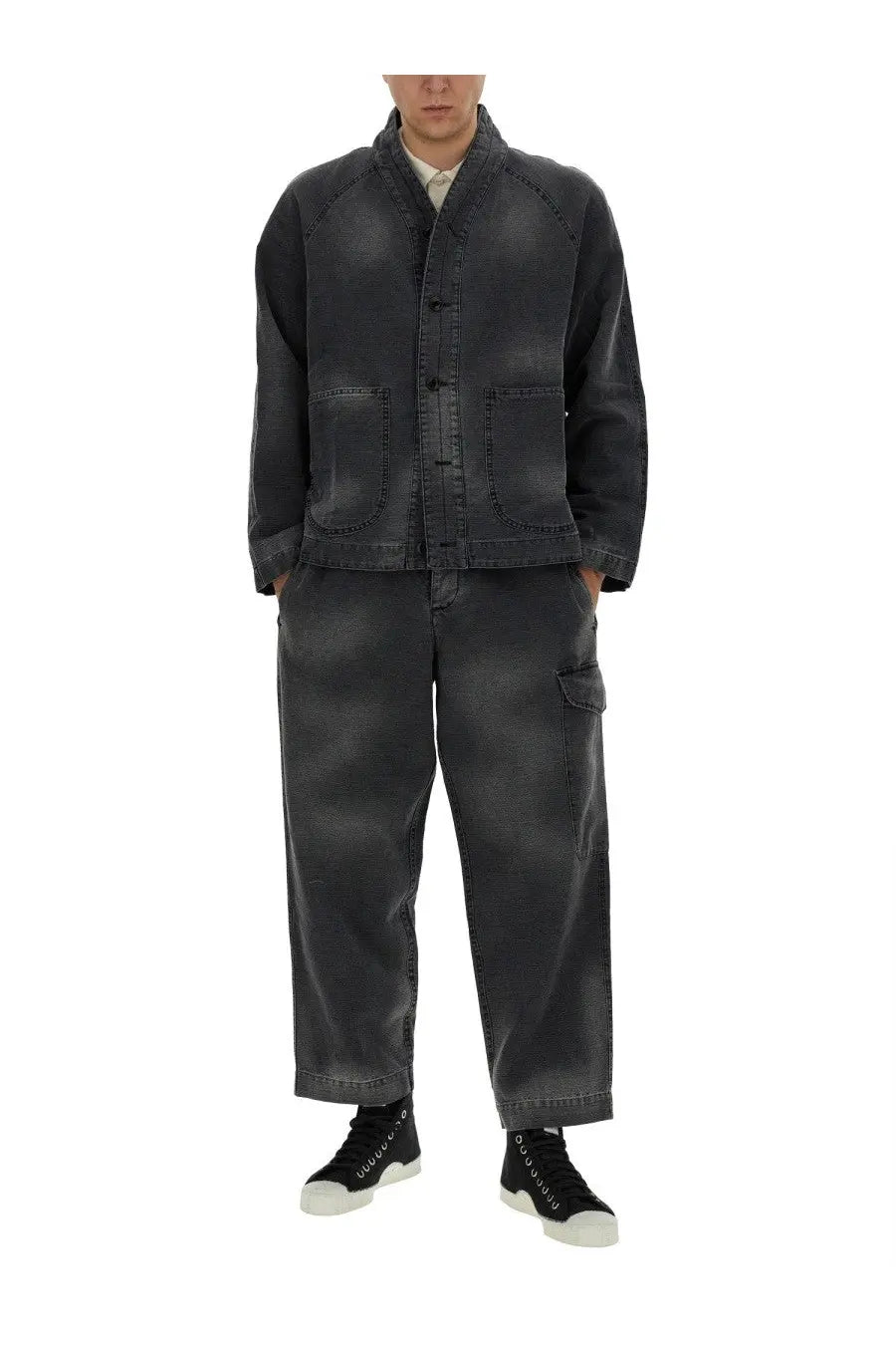 Dark gray denim jacket with mandarin collar and front button closure paired with ymc men’s military black pants
