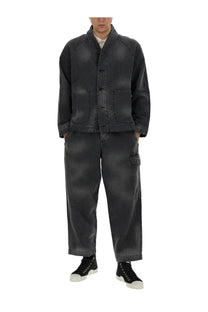Dark gray denim jacket with mandarin collar and front button closure paired with ymc men’s military black pants